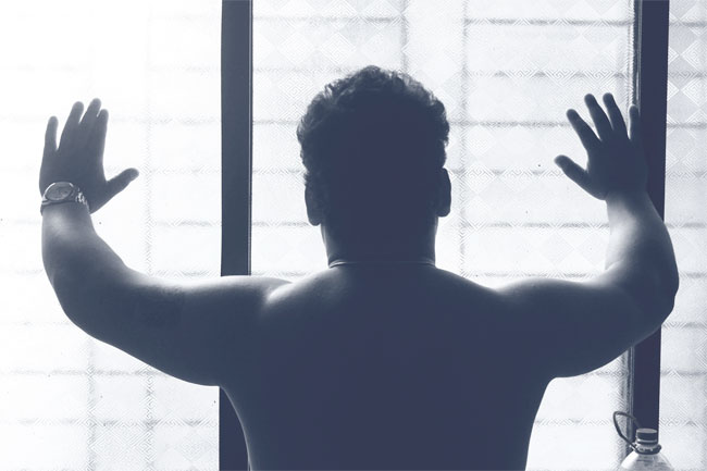 A man looks out the window