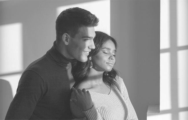 Couple looking out the window